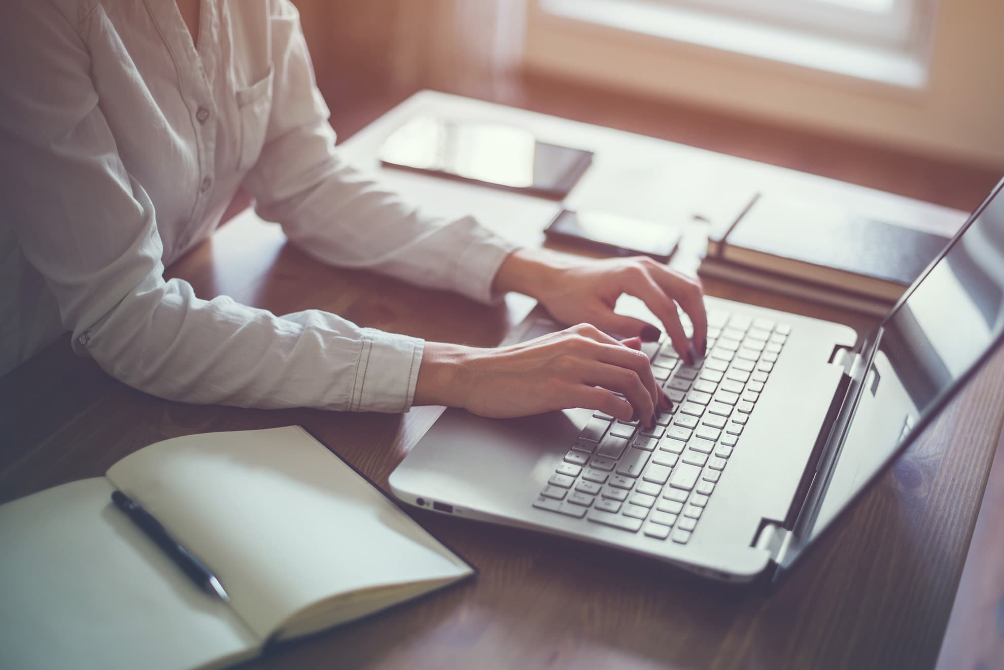 Someone typing on a keyboard